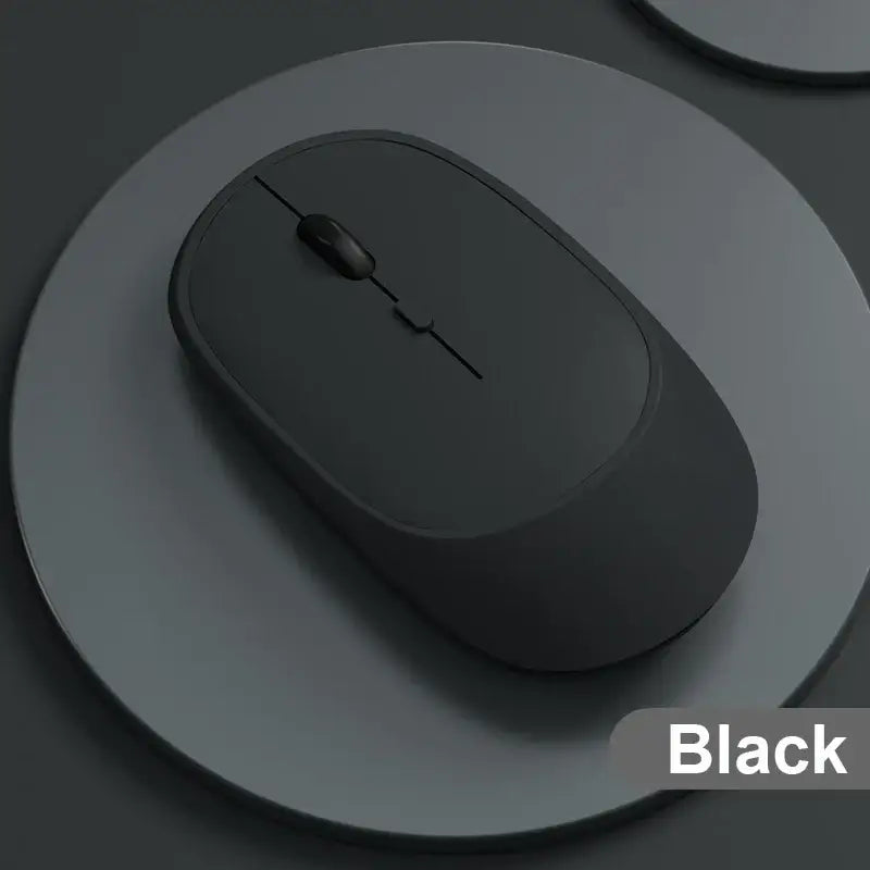 Sleek rechargeable wireless mouse on a circular gray surface for your office gadgets